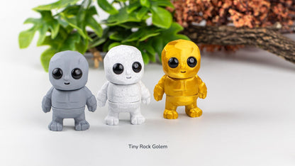 Grey, white and yellow Tiny Rock Golems together