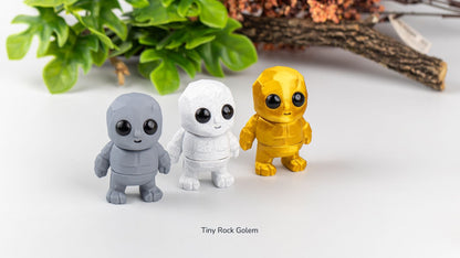 Three Tiny Rock Golems in grey, white and yellow