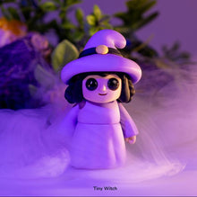 Tiny Witch in a purple hat and dress in purple mist