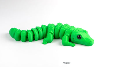 Green alligator toy on a white background