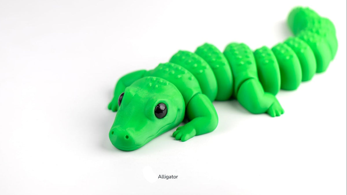 Green alligator toy on a white background
