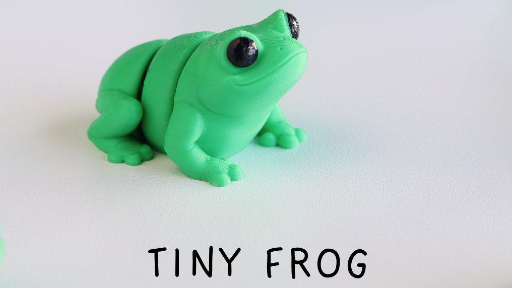 Green frog figurines labeled 'Baby Frog' on a white background